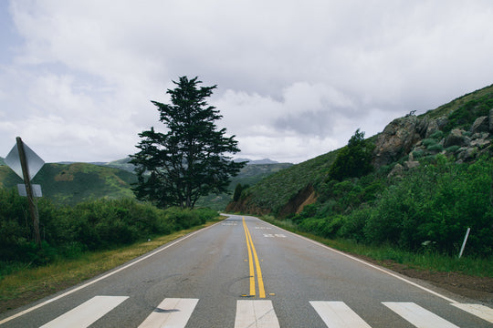 Crosswalk in grassy hill landscape